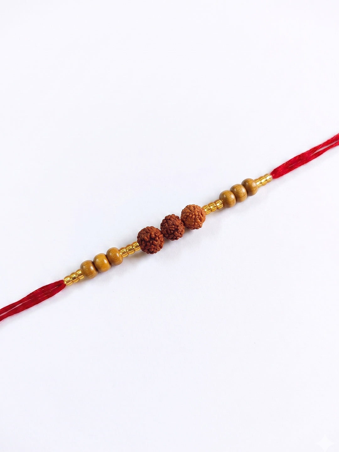 NVR Religious Rudraksh & Red Thread Rakhi with Roli Chawal Chandan Mishri