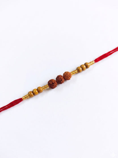 NVR Religious Rudraksh & Red Thread Rakhi with Roli Chawal Chandan Mishri