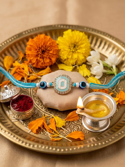 NVR Blue Evil Eye & Artificial Stones Oval Shape Thread Rakhi with Roli Chawal Chandan