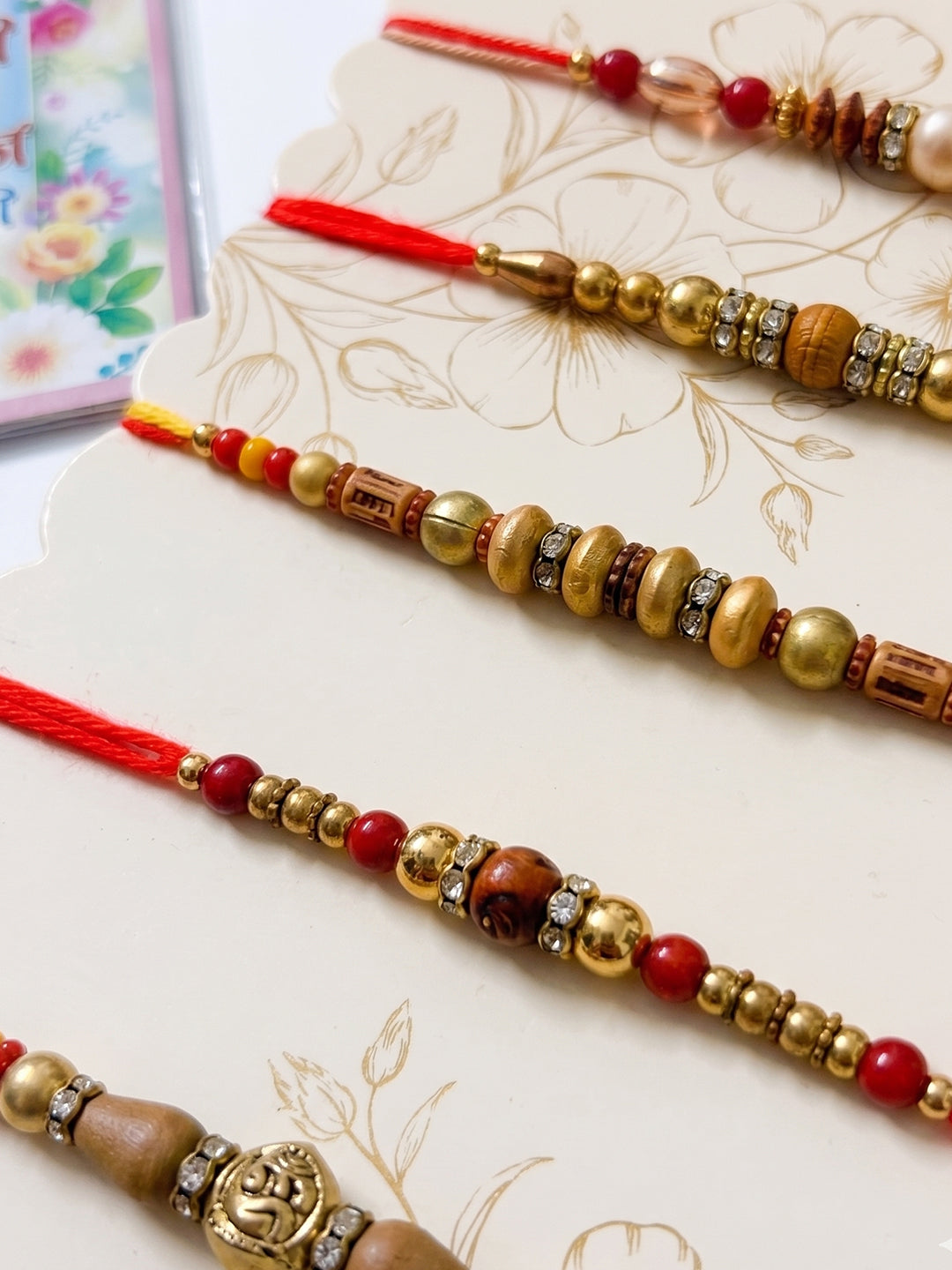 NVR Set of 5 Multicolor Designer Thread Rakhi with Roli Chawal Chandan Mishri