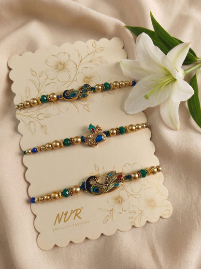 NVR Set of 3 Peacock Design Multicolor Artificial Beads Thread Rakhi With Roli Chawal