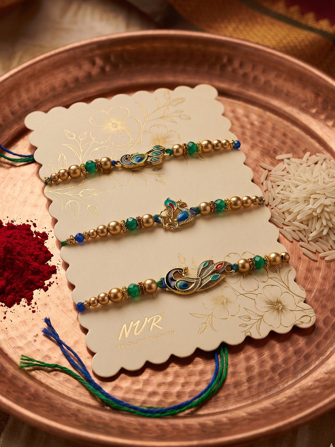 NVR Set of 3 Peacock Design Multicolor Artificial Beads Thread Rakhi With Roli Chawal