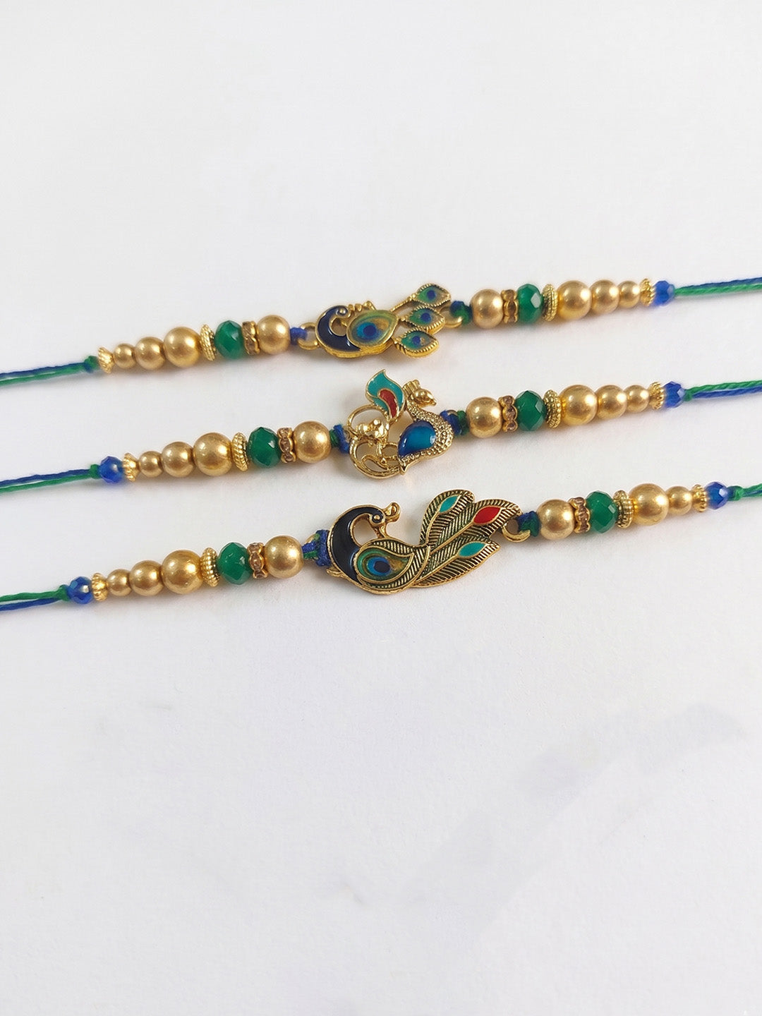 NVR Set of 3 Peacock Design Multicolor Artificial Beads Thread Rakhi With Roli Chawal