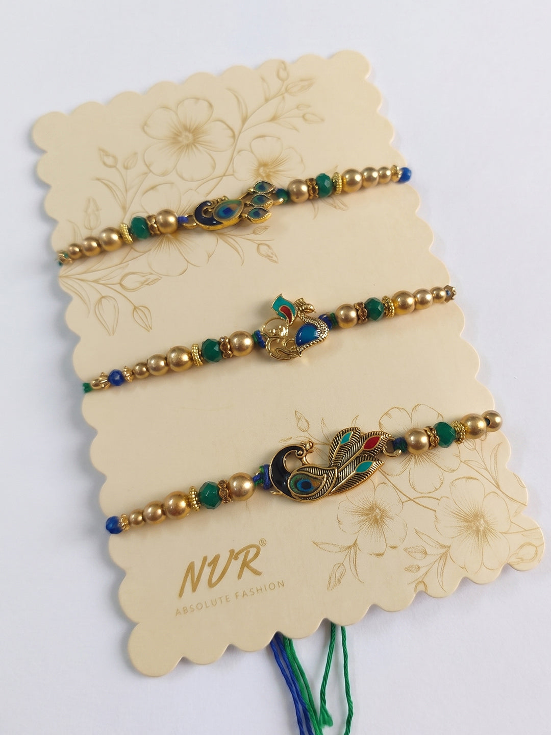 NVR Set of 3 Peacock Design Multicolor Artificial Beads Thread Rakhi With Roli Chawal