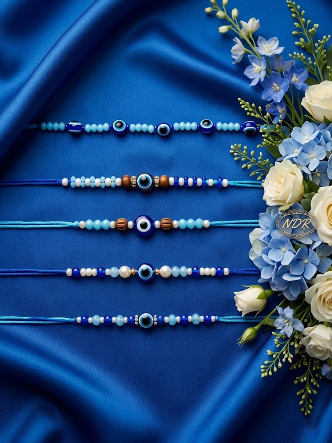 NVR Set of 5 Blue Evil Eye Thread Rakhi with Roli Chawal Chandan Mishri