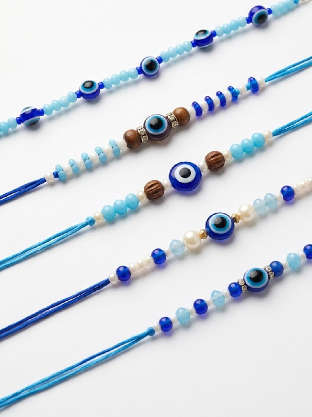 NVR Set of 5 Blue Evil Eye Thread Rakhi with Roli Chawal Chandan Mishri