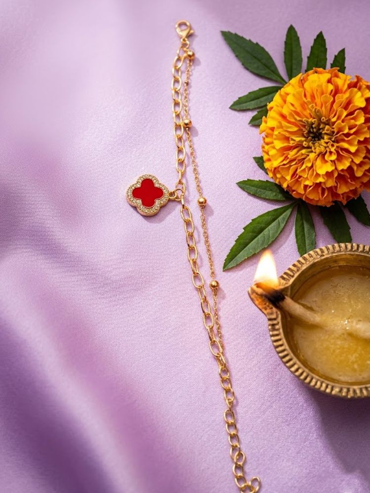NVR Women Artrificial Stones Gold Plated Rakhi with Roli Chawal Chandan Mishri
