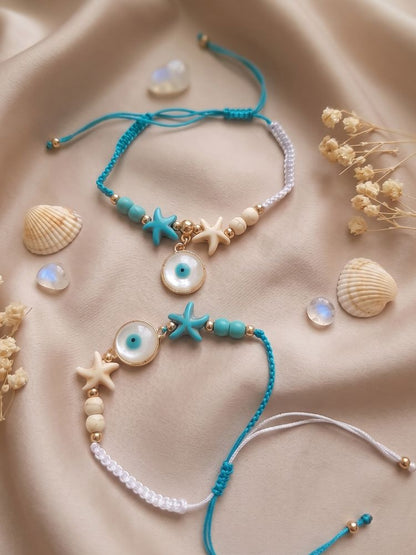 NVR Set of 2 Blue Evil Eye & White Pearl Bhaiya Bhabhi Rakhi with Roli Chawal Chandan