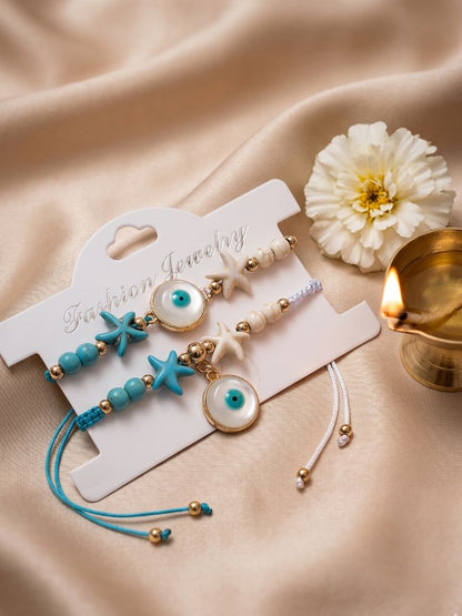 NVR Set of 2 Blue Evil Eye & White Pearl Bhaiya Bhabhi Rakhi with Roli Chawal Chandan