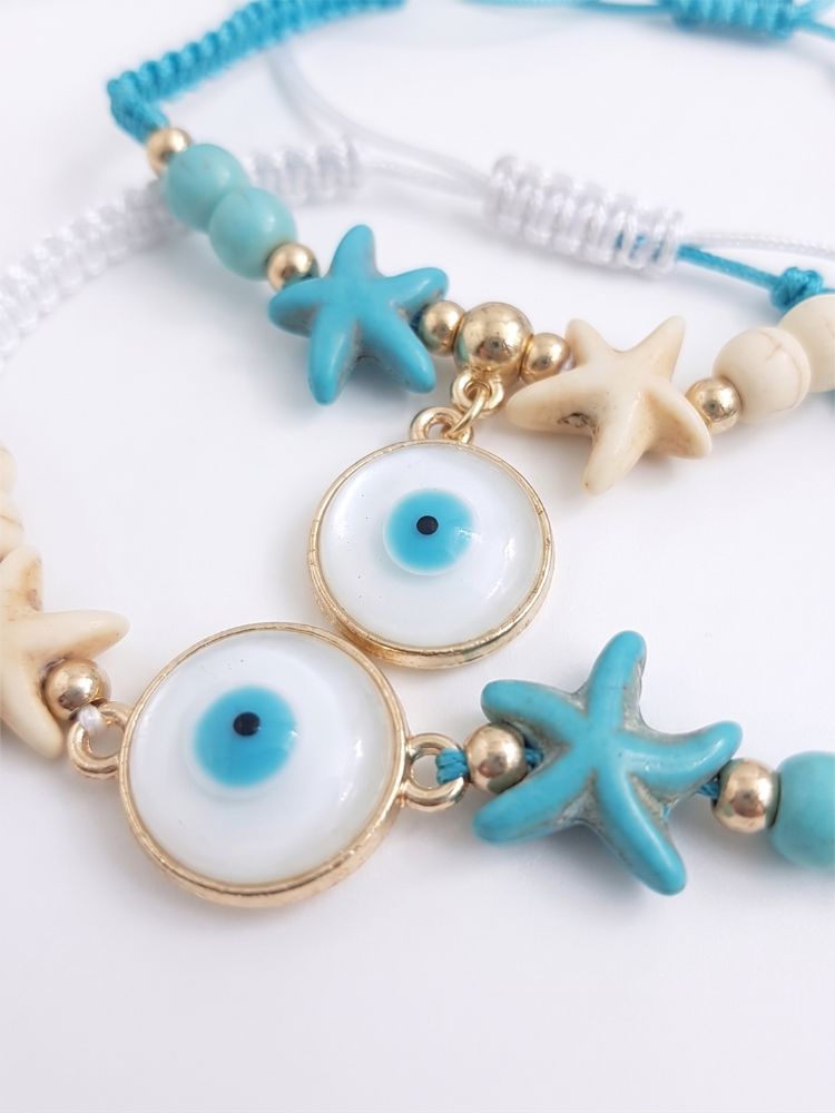 NVR Set of 2 Blue Evil Eye & White Pearl Bhaiya Bhabhi Rakhi with Roli Chawal Chandan