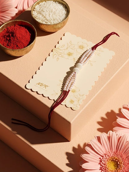 NVR White Pearls & Red Thread Rakhi with Roli Chawal Chandan Mishri