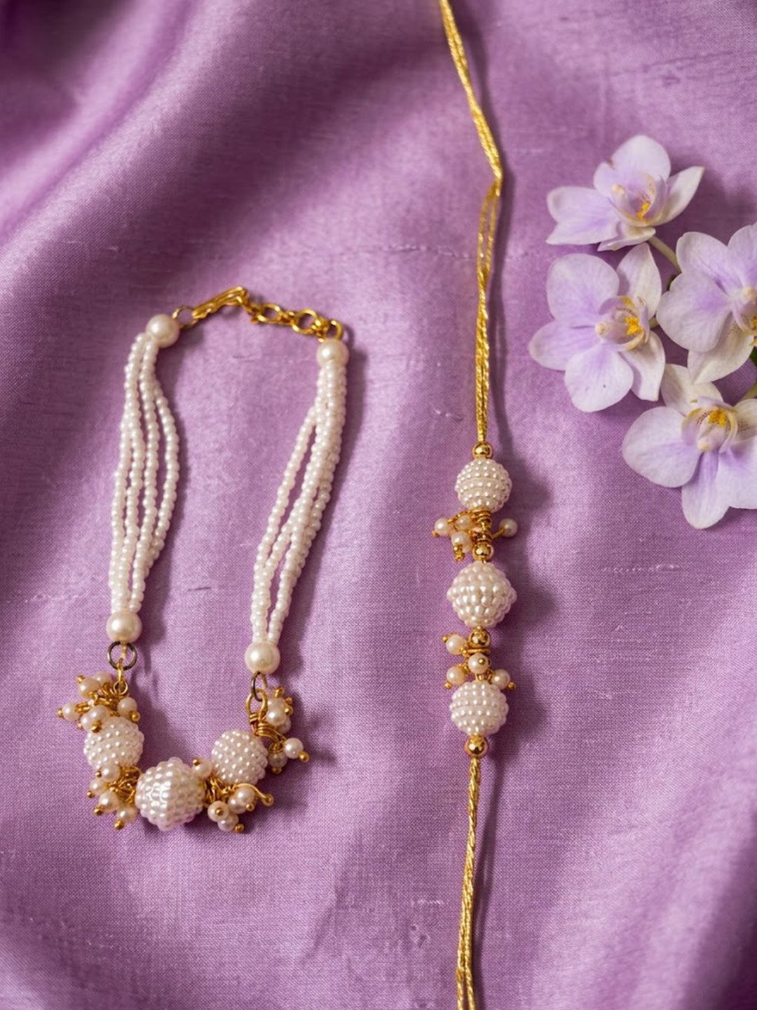 NVR Set of 2 Gold Toned & White Pearls Bhaiya Bhabhi Rakhi with Roli Chawal Chandan Mishri