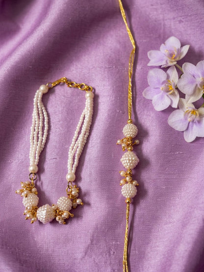 NVR Set of 2 Gold Toned & White Pearls Bhaiya Bhabhi Rakhi with Roli Chawal Chandan Mishri