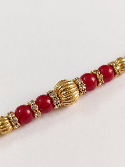 NVR Set of 4 Artificial Beads Red Thread Rakhi With Roli Chawal Chandan Mishri