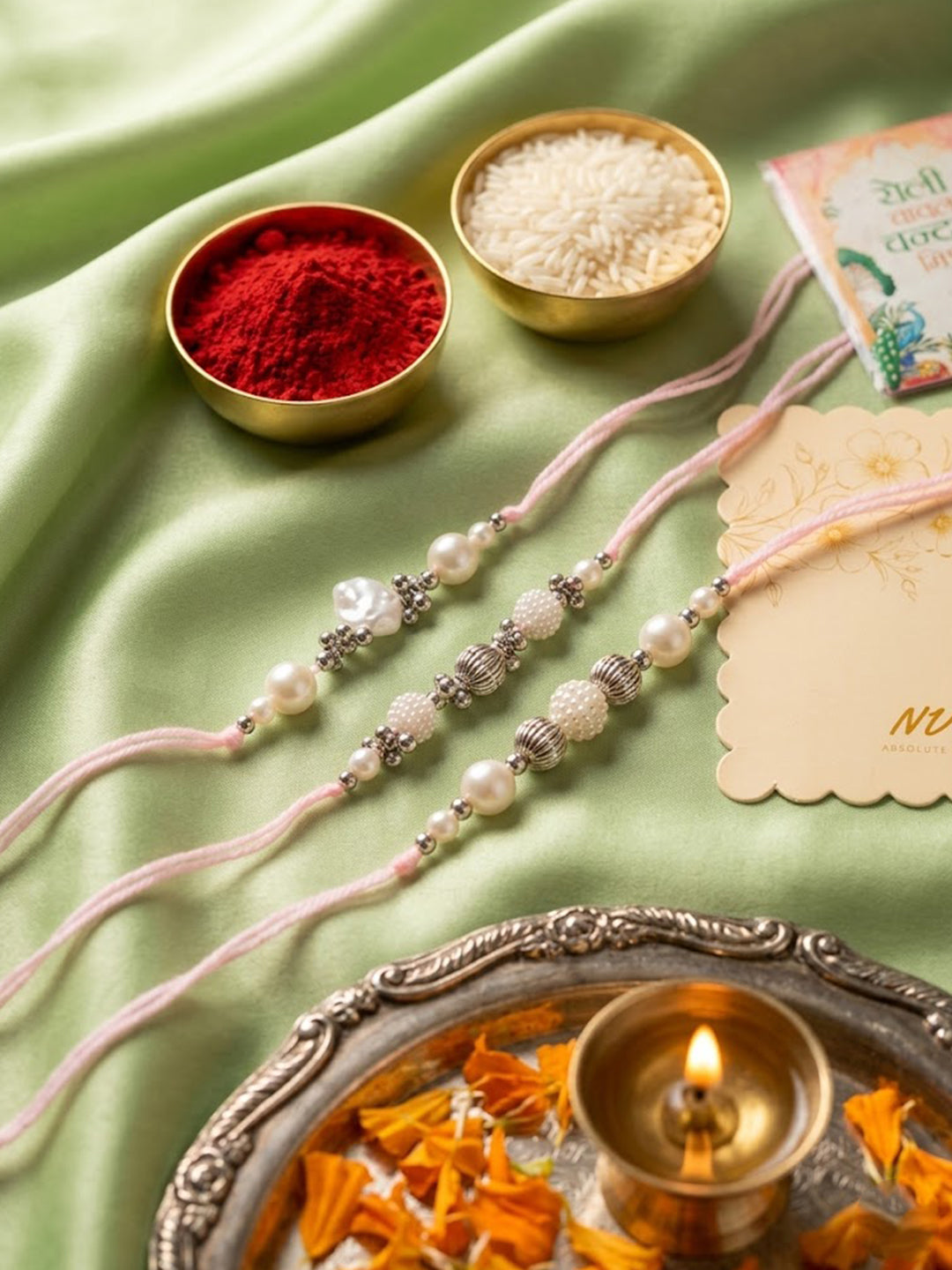 NVR Set of 3 White Pearls Thread Rakhi with Roli Chawal Chandan Mishri