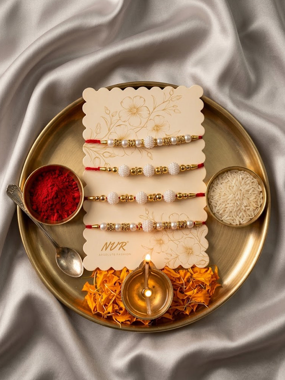 NVR Set of 4 White Pearls & Red Thread Rakhi With Roli Chawal Chandan Mishri