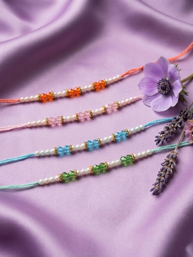NVR Set of 4 White Pearls & Multicolor Thread Rakhi With Roli Chawal Chandan Mishri
