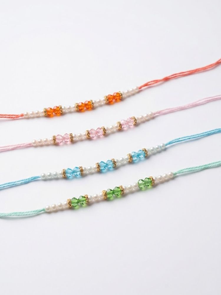 NVR Set of 4 White Pearls & Multicolor Thread Rakhi With Roli Chawal Chandan Mishri