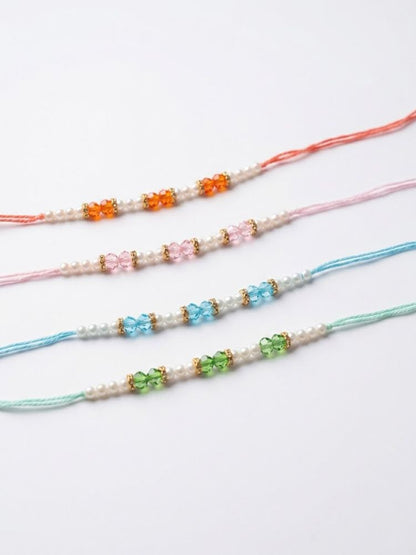 NVR Set of 4 White Pearls & Multicolor Thread Rakhi With Roli Chawal Chandan Mishri