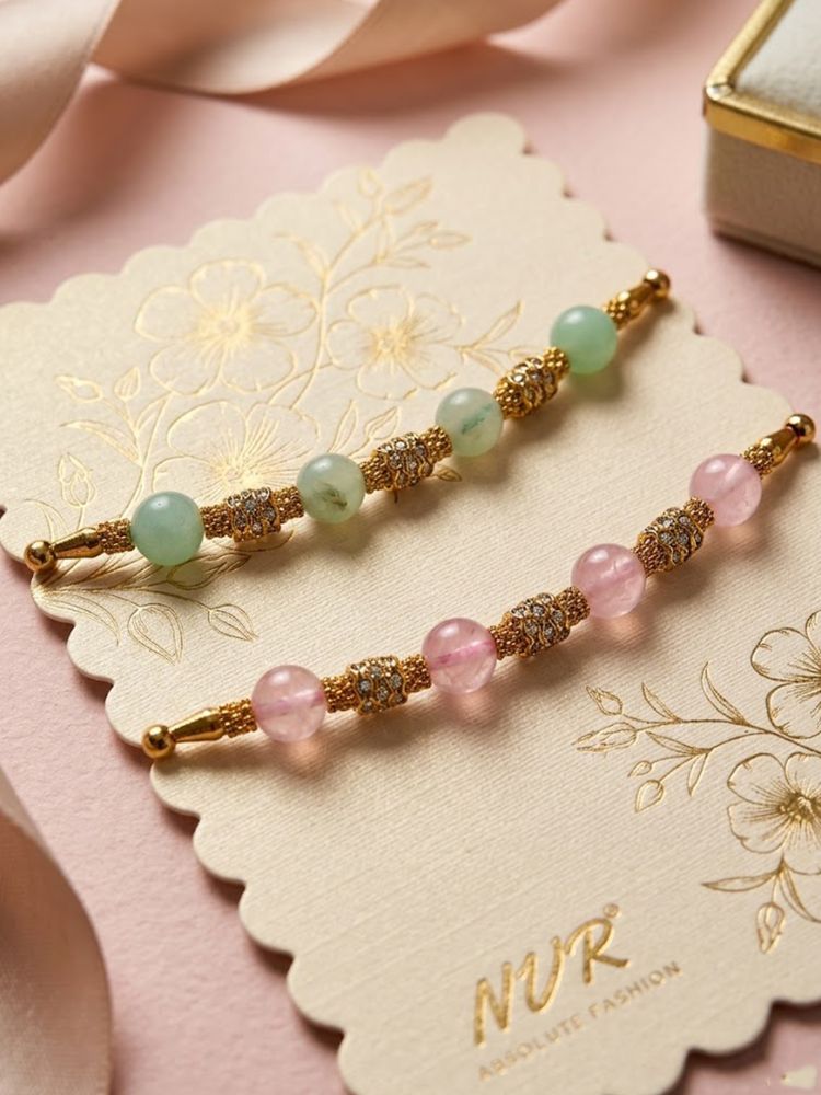 NVR Set of 2 Pink & Green Artificial Beads Thread Rakhi With Roli Chawal Chandan Mishri