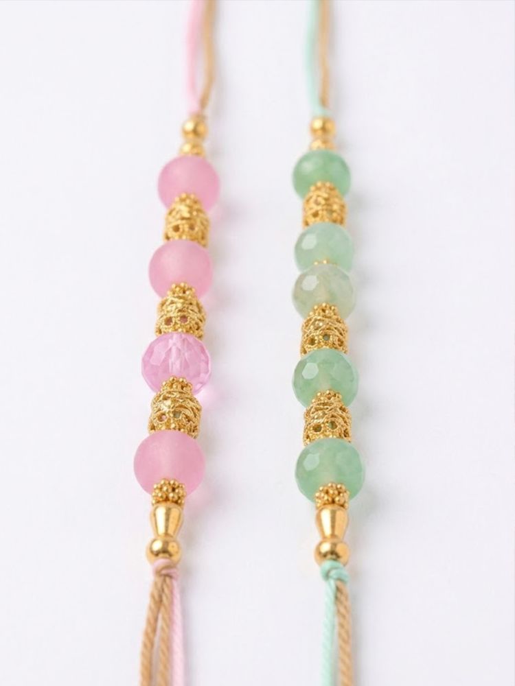 NVR Set of 2 Pink & Green Artificial Beads Thread Rakhi With Roli Chawal Chandan Mishri