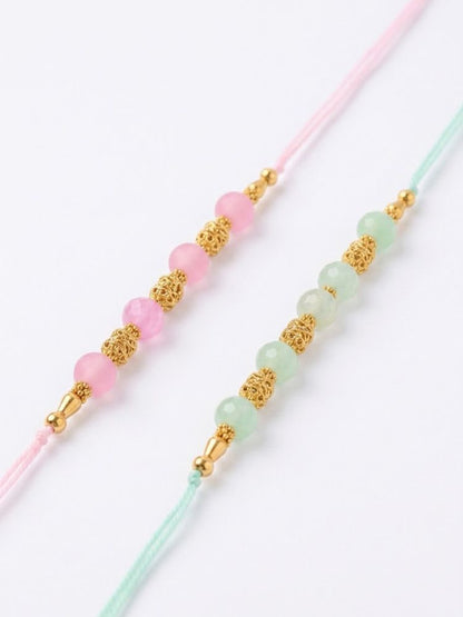 NVR Set of 2 Pink & Green Artificial Beads Thread Rakhi With Roli Chawal Chandan Mishri