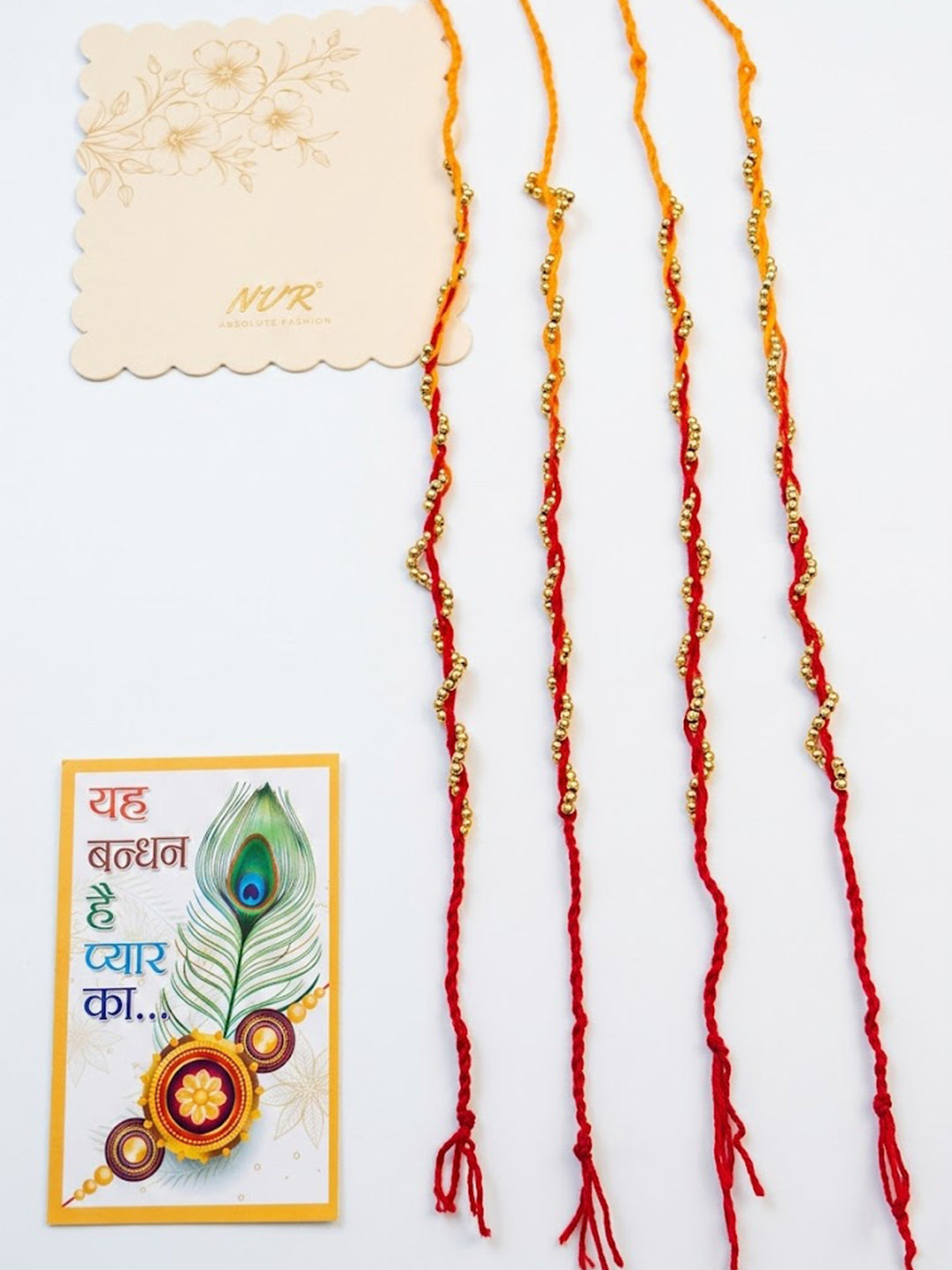 NVR Set of 4 Red & Yellow Thread Rakhi with Roli Chawal Chandan Mishri