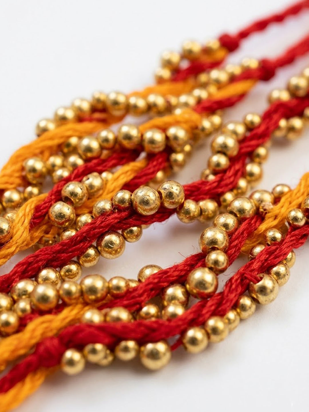 NVR Set of 4 Red & Yellow Thread Rakhi with Roli Chawal Chandan Mishri