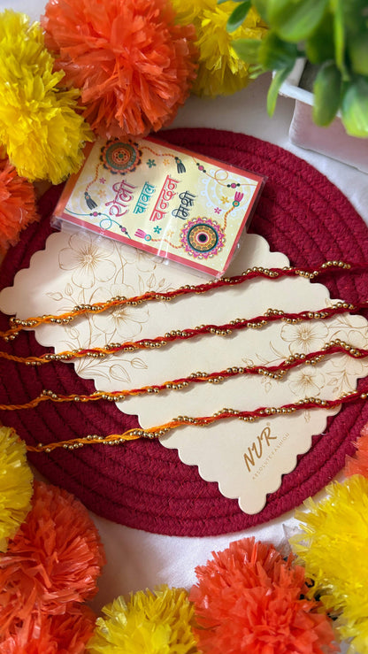 NVR Set of 4 Yellow & Red Thread Rakhi with Roli Chawal Chandan Mishri