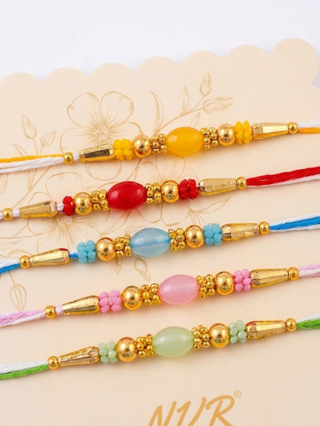 NVR Set of 5 Multi Artificial Beads Thread Rakhi with Roli Chawal Chandan Mishri