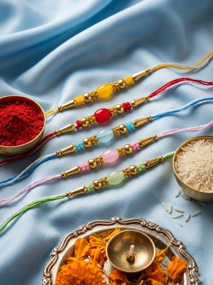 NVR Set of 5 Multi Artificial Beads Thread Rakhi with Roli Chawal Chandan Mishri
