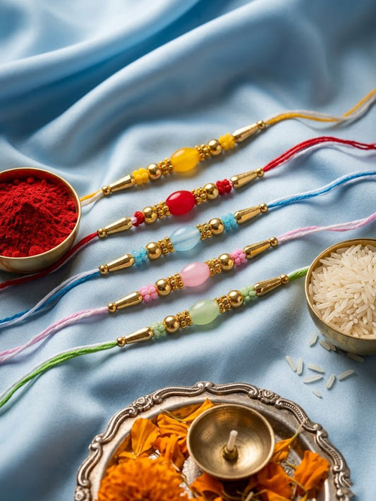 NVR Set of 5 Multi Artificial Beads Thread Rakhi with Roli Chawal Chandan Mishri