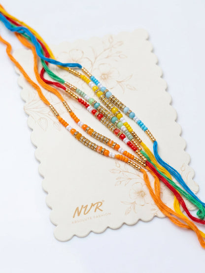 NVR Set of 6 Multi Artificial Beads Thread Rakhi with Roli Chawal Chandan Mishri