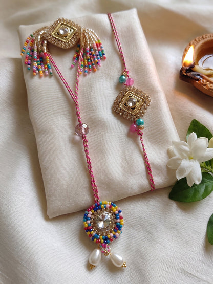 NVR Set of 2 White Artificial Stones Golden Toned Bhaiya Bhabhi Rakhi With Roli Chawal