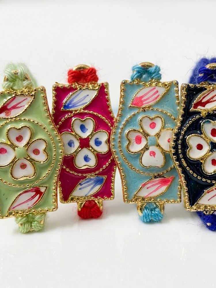 NVR Set of 4 Multicolor Heart Shape Thread Rakhi with Roli Chawal Chandan Mishri