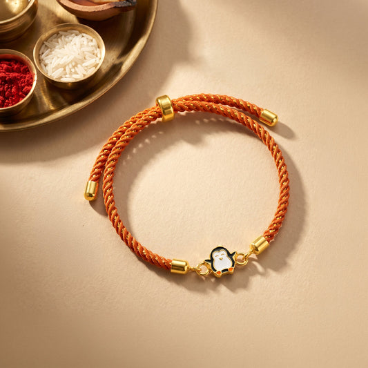 Golden Penguin Joy Rakhi