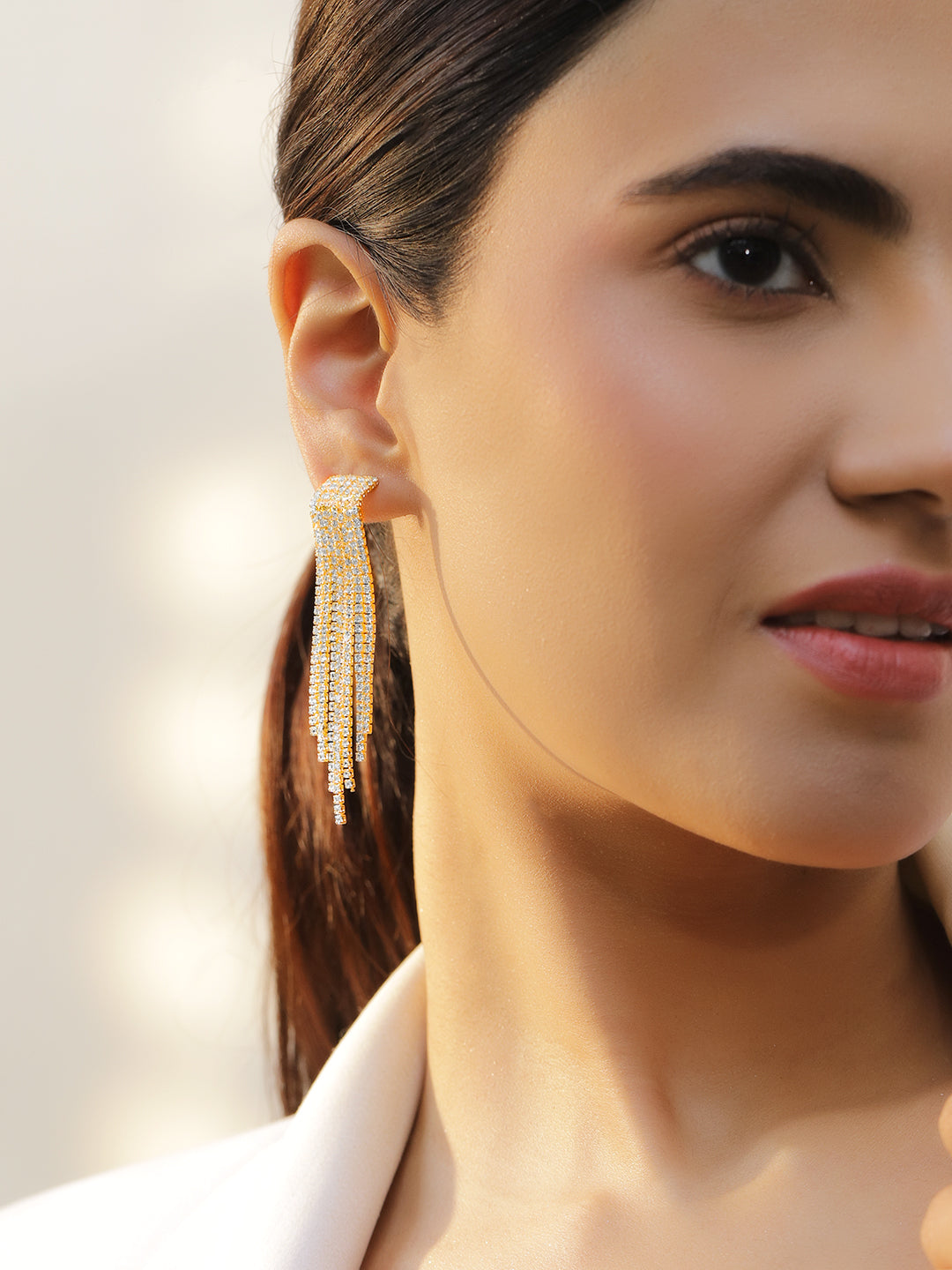 Crystal Studded Gold Toned Tassel Dangler Earrings