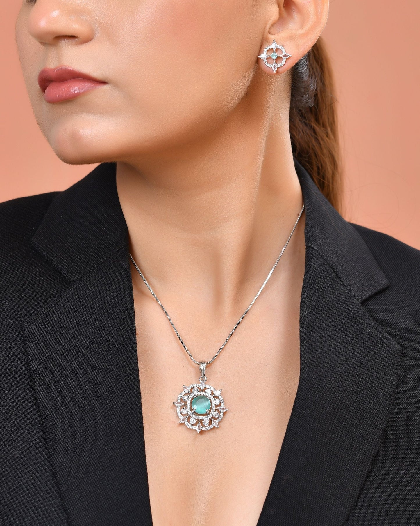 VOJ Silver Plated Sea Green Circulare Stone Studded Sun Shaped Ad Pendant With Chain Set