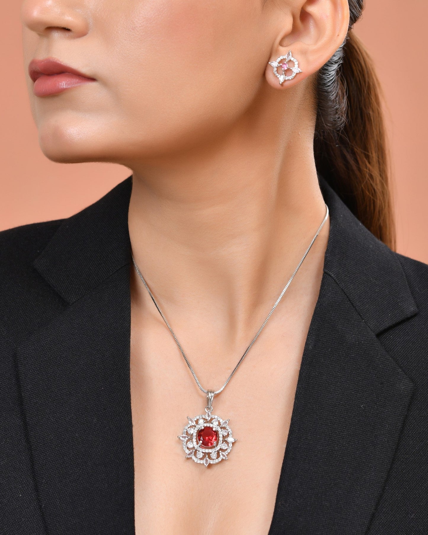 VOJ Silver Plated Ruby Red Circular Stone Studded Sun Shaped Ad Pendant With Chain Set