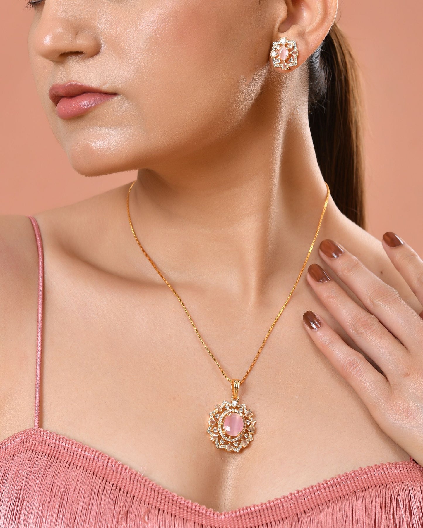 VOJ Gold Toned Baby Pink Oval Stone Studded Sun Shaped Ad Pendant With Chain Set