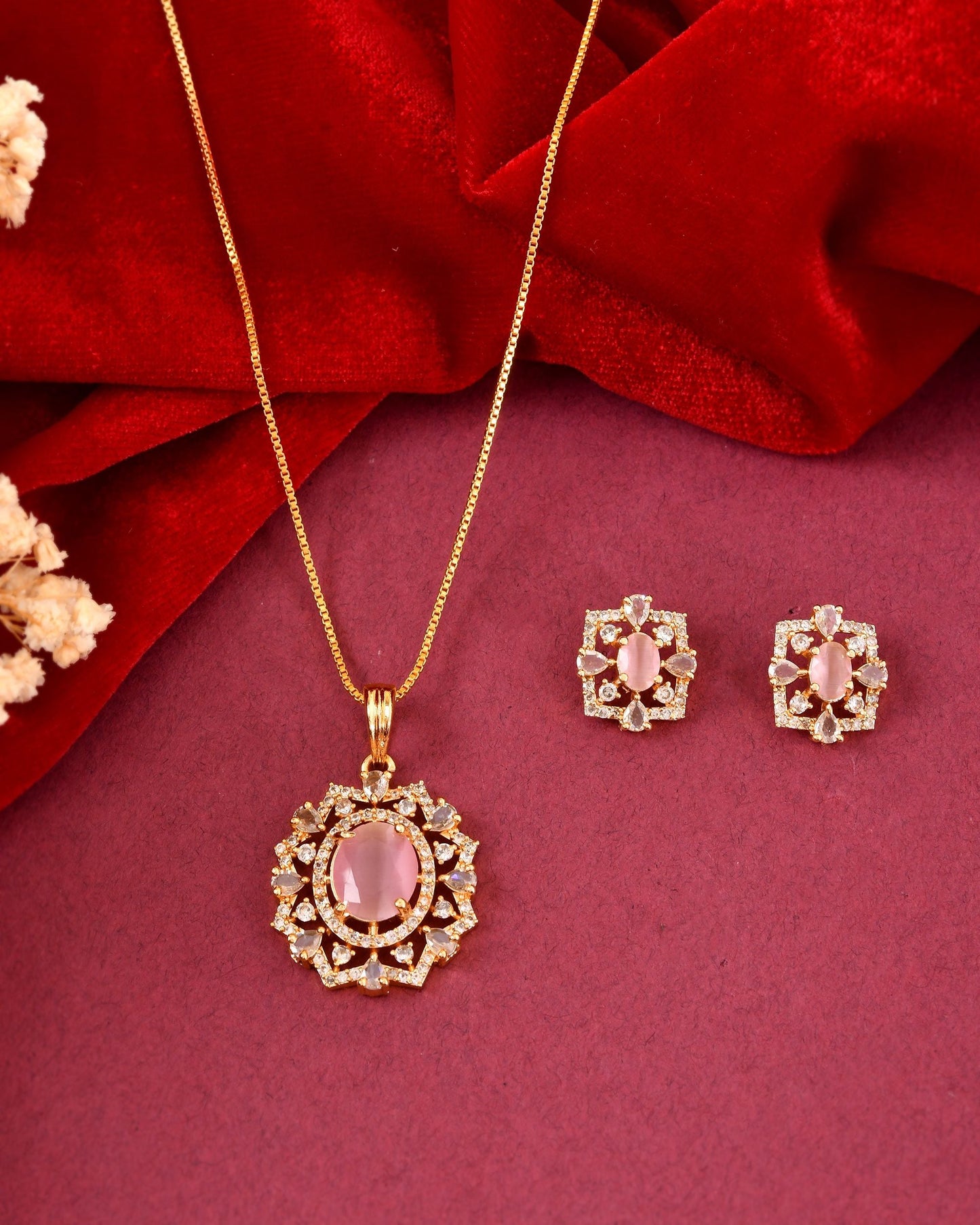 VOJ Gold Toned Baby Pink Oval Stone Studded Sun Shaped Ad Pendant With Chain Set