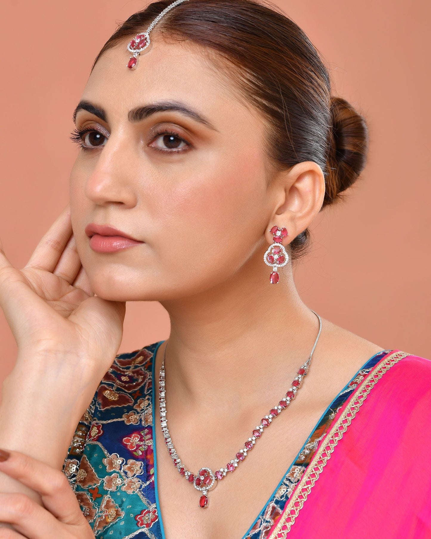 VOJ Silver Plated Ruby Red Stone Studded Ad Jewellery Set With Maang Tikka