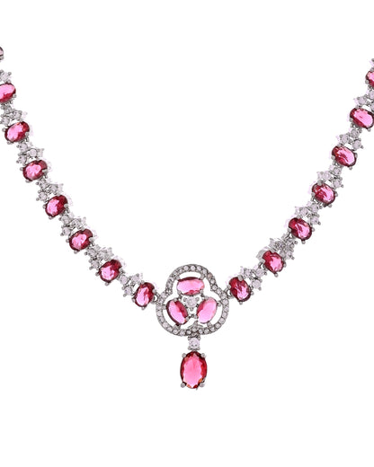 VOJ Silver Plated Ruby Red Stone Studded Ad Jewellery Set With Maang Tikka