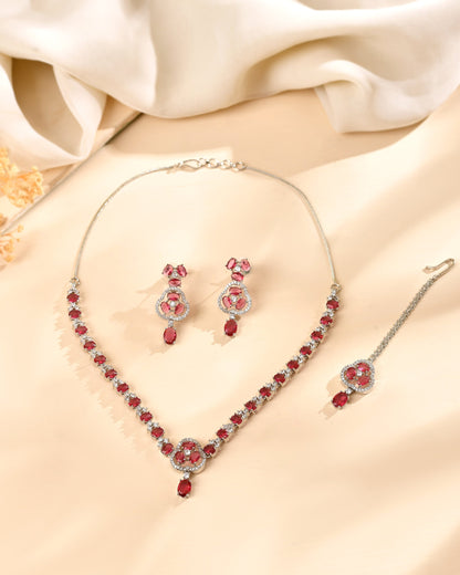 VOJ Silver Plated Ruby Red Stone Studded Ad Jewellery Set With Maang Tikka