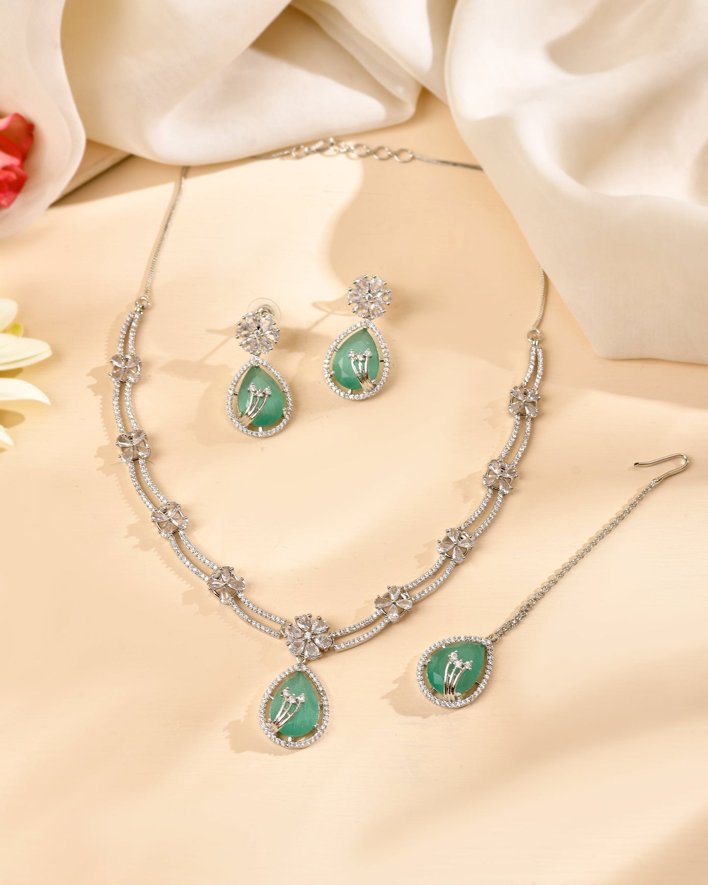 VOJ Silver Plated Teal Green Teardrop Shaped Stone And Ad Stone Jewellery Set With Maang Tikka