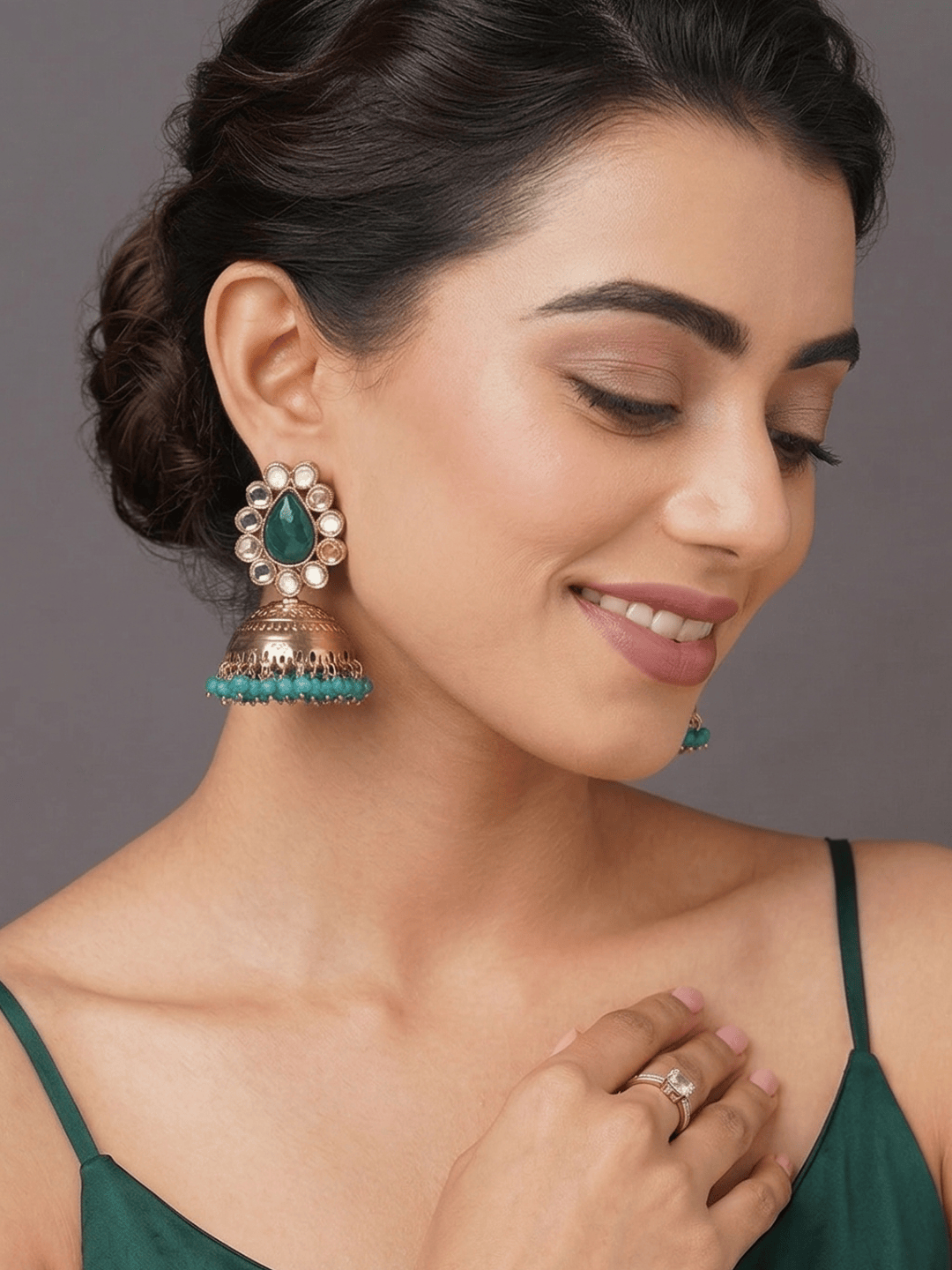 Gold toned green jhumka earring