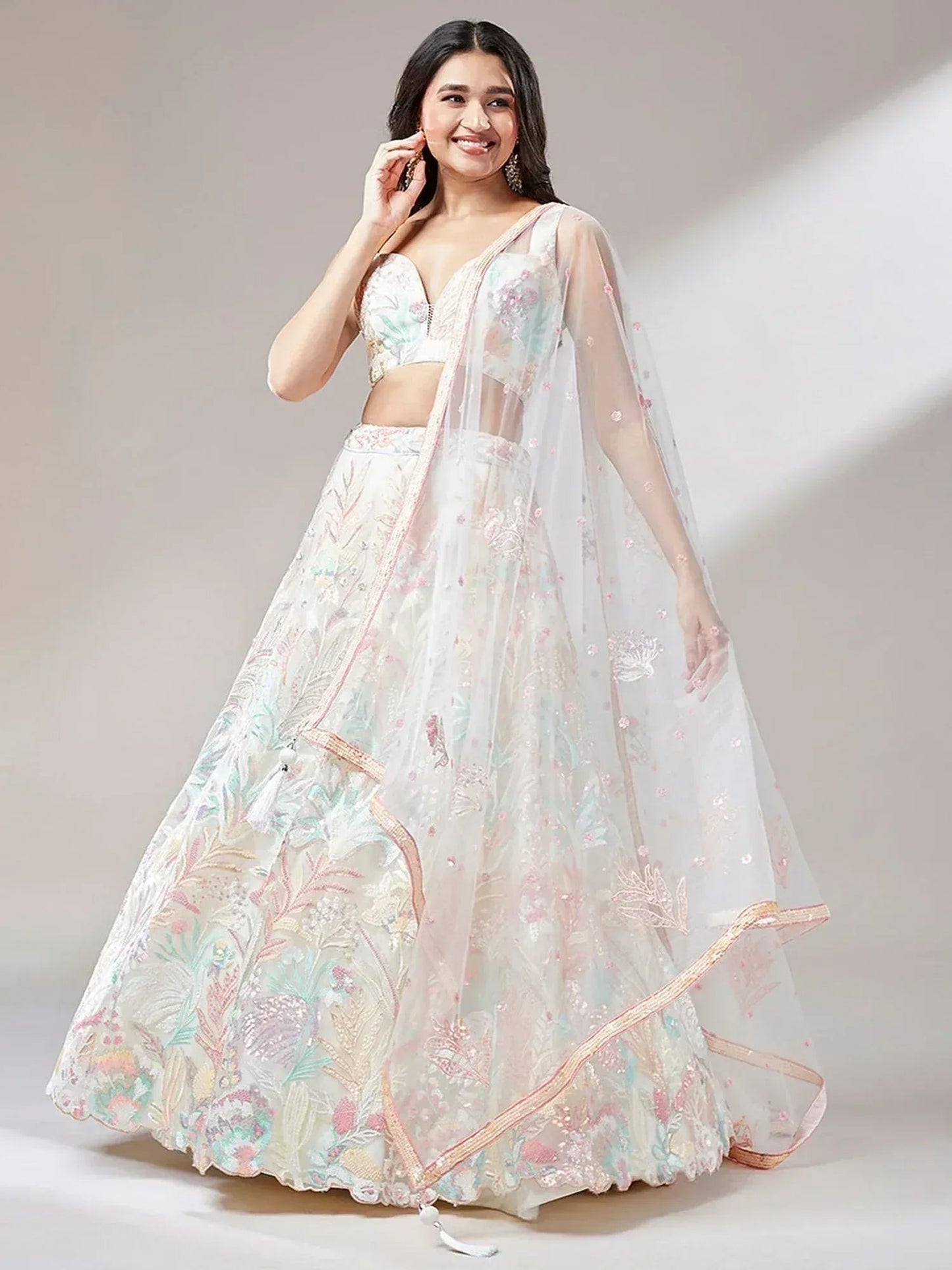 Tulsi Art Astounding Off-White Sequins Soft Net Wedding Wear Lehenga Choli