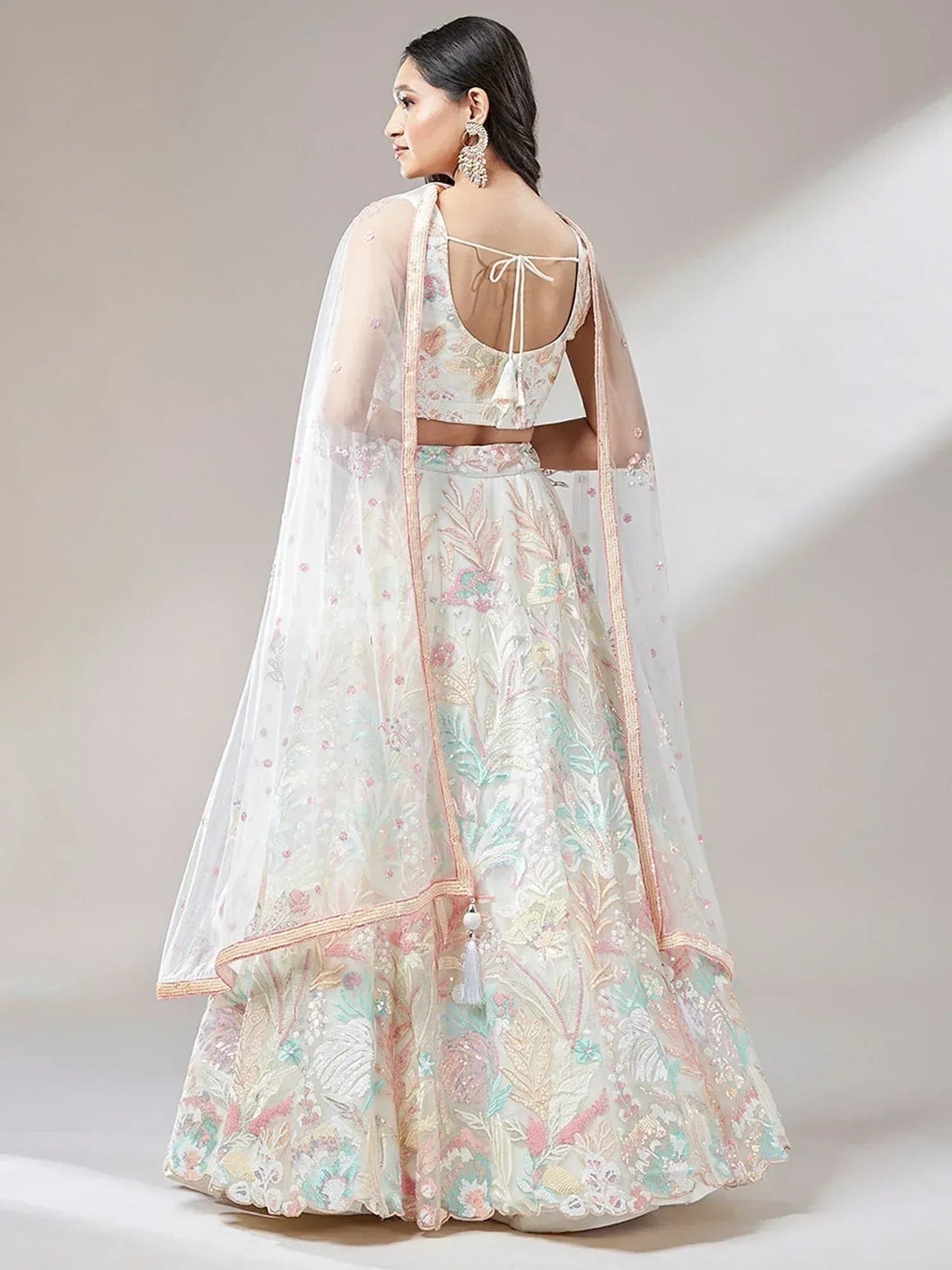 Tulsi Art Astounding Off-White Sequins Soft Net Wedding Wear Lehenga Choli