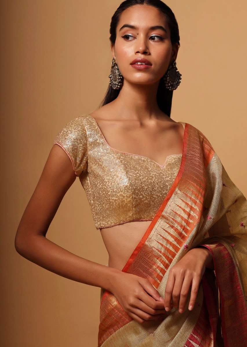 Gold Blouse In Net With Contrasting Peach Piping Around The Edges And Sequins Work All Over