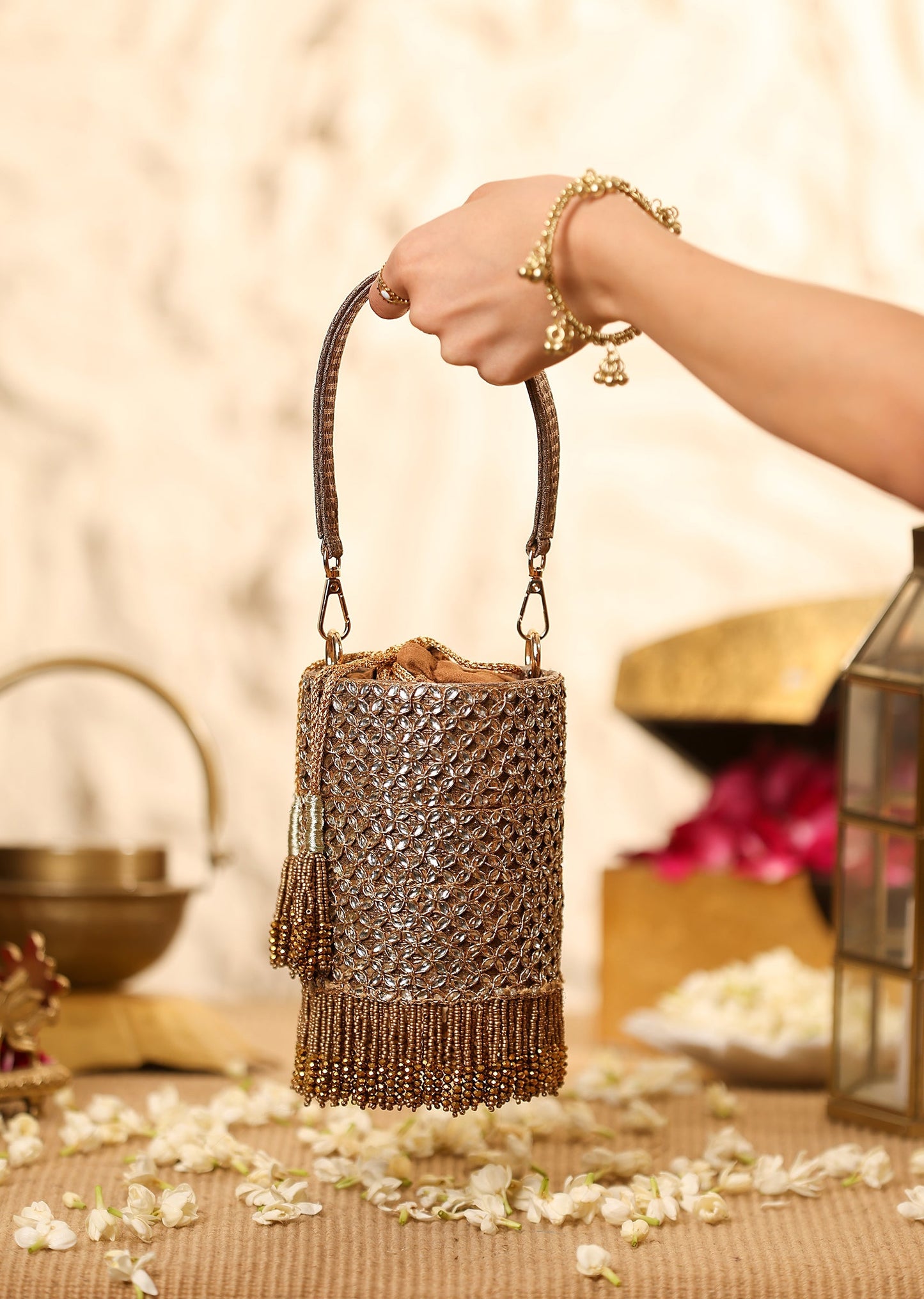 Gold Mixed Metal Potli With Embellished Detailing